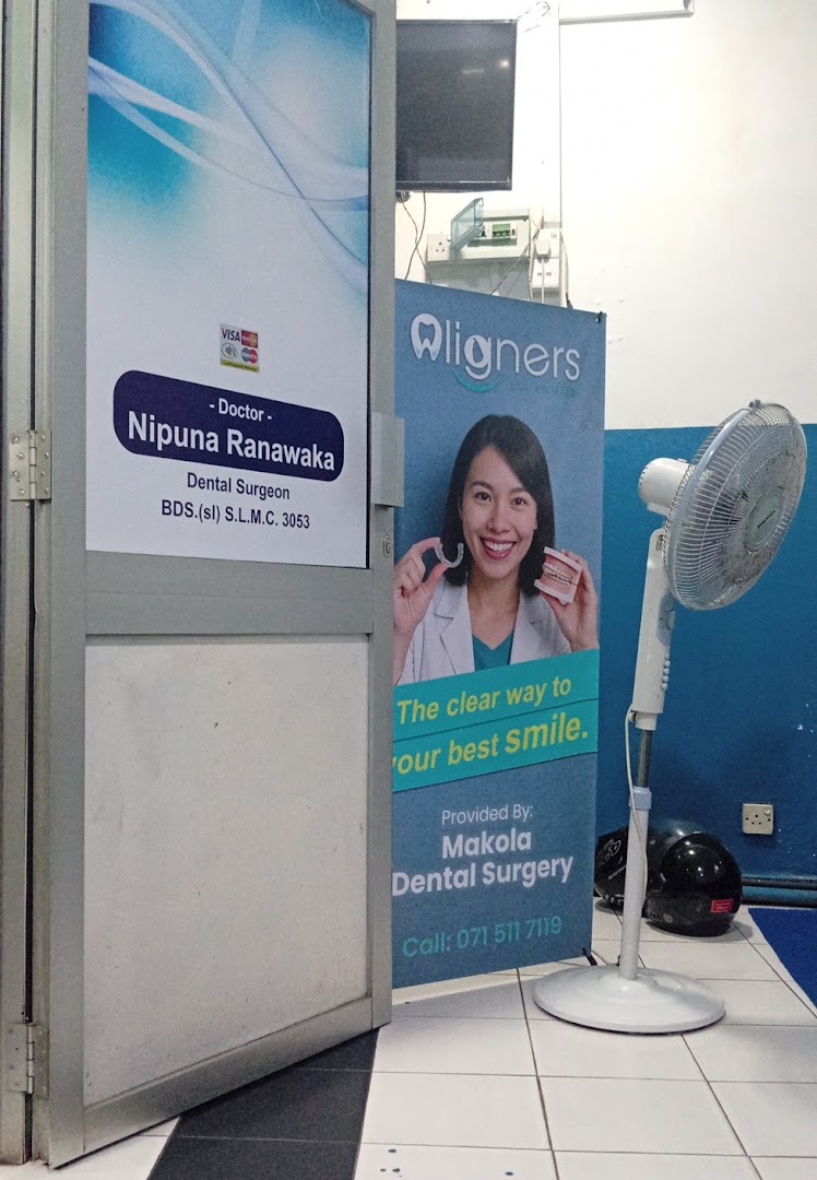 Door signage for Dr. Nipuna Ranawaka beside dental treatment material